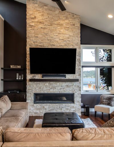 A living room with a fireplace and sliding glass doors.